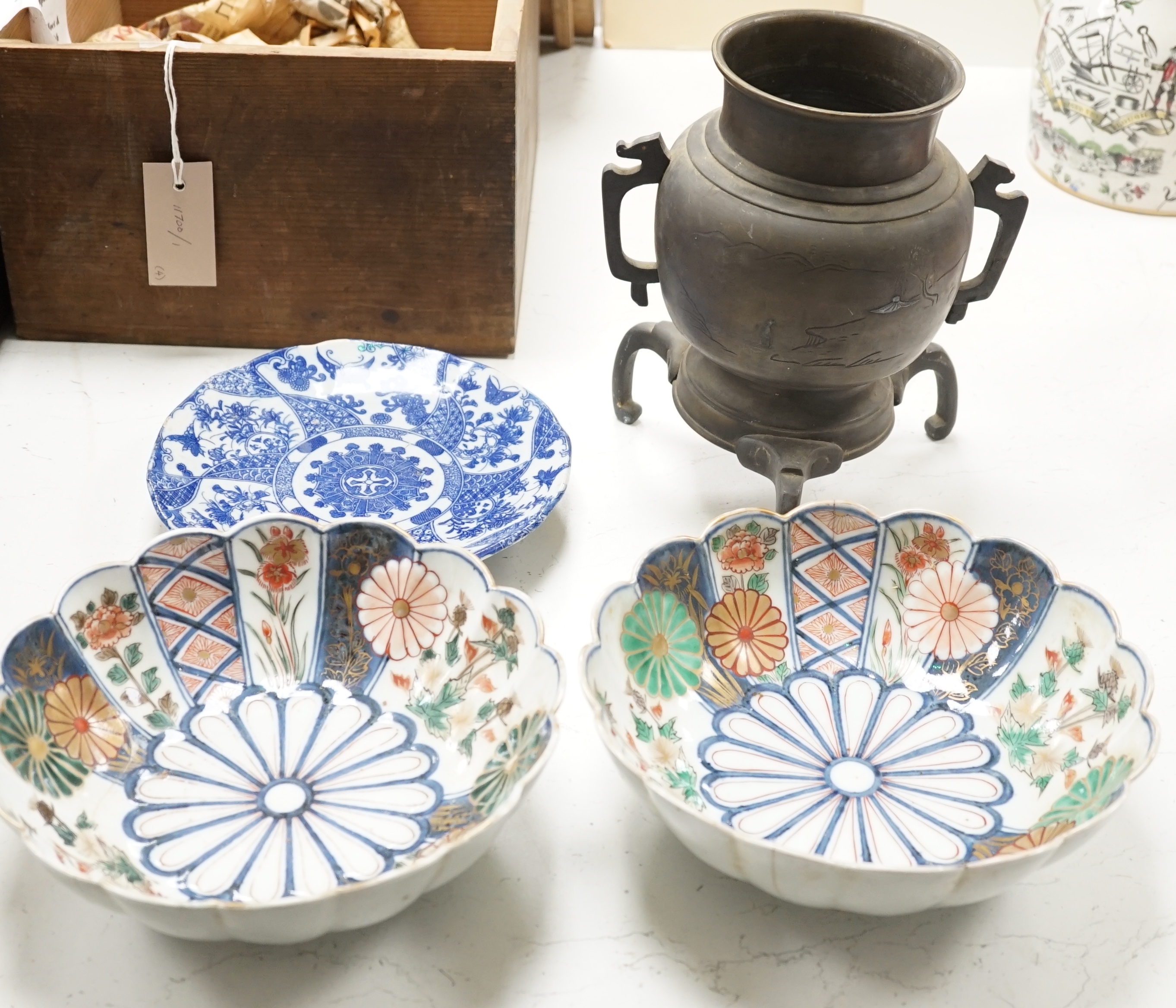 A Japanese bronze and mixed metal tripod vessel, a pair of 19th century Japanese Imari scalloped bowls, 22.5 cm diameter and a blue and white plate